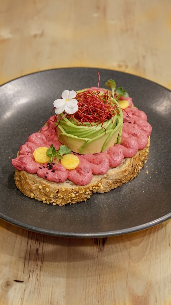 avocado toast on a black plate