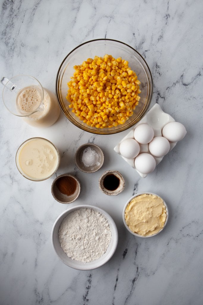 corn in a bowl, eggs, flour, evaporated milk