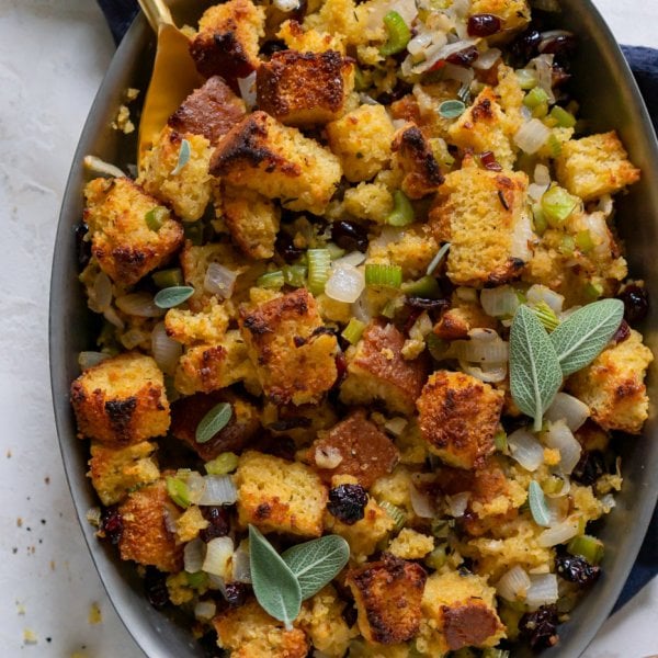 vegetarian cornbread stuffing with a gold spoon