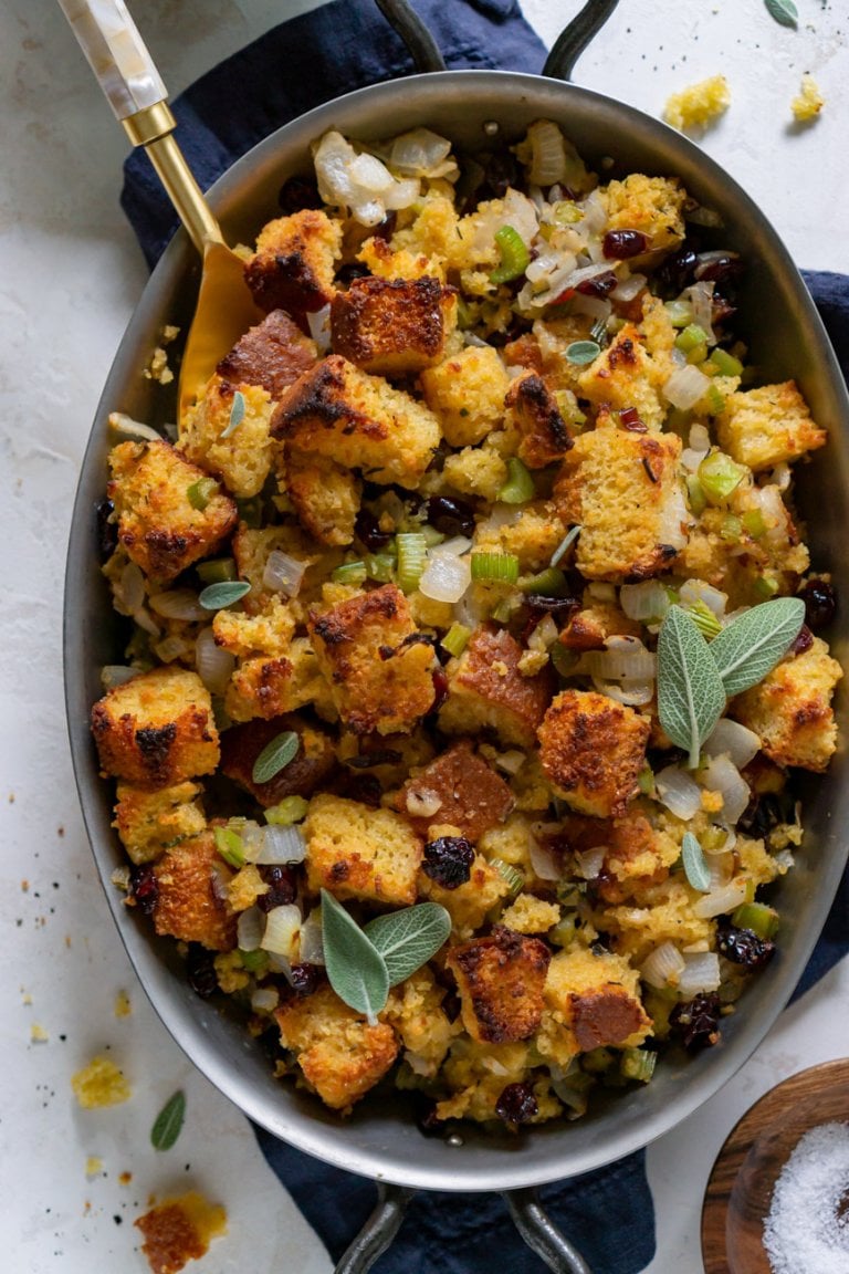 vegetarian cornbread stuffing with a gold spoon