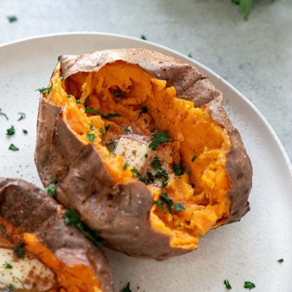 air fryer baked sweet potato on a white plate