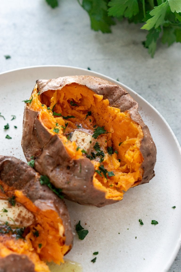 air fryer baked sweet potato on a white plate