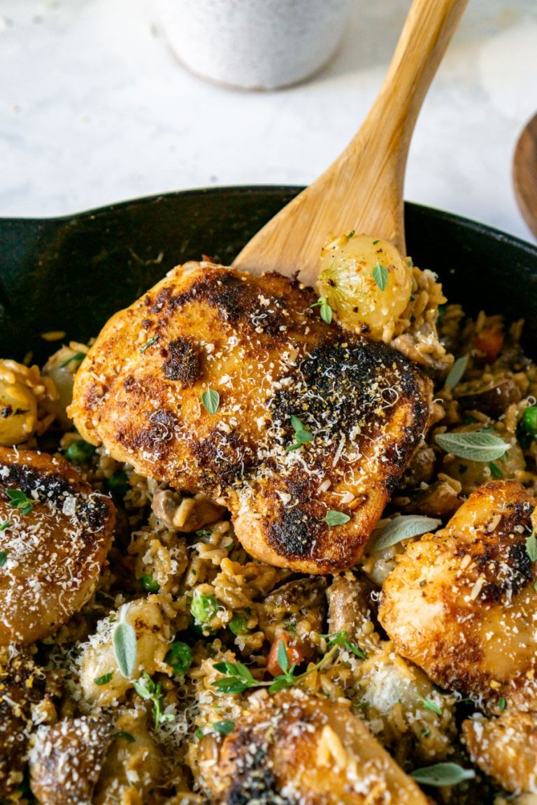 serving creamy chicken and rice from a skillet