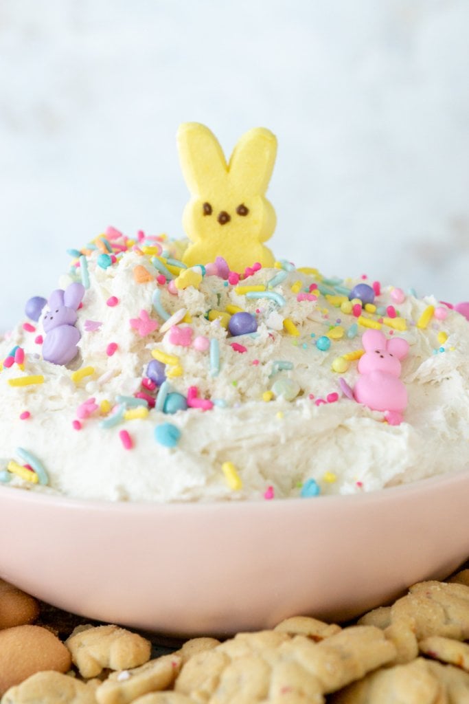 easter dunkaroo dip in a light pink bowl with a yellow peep on top