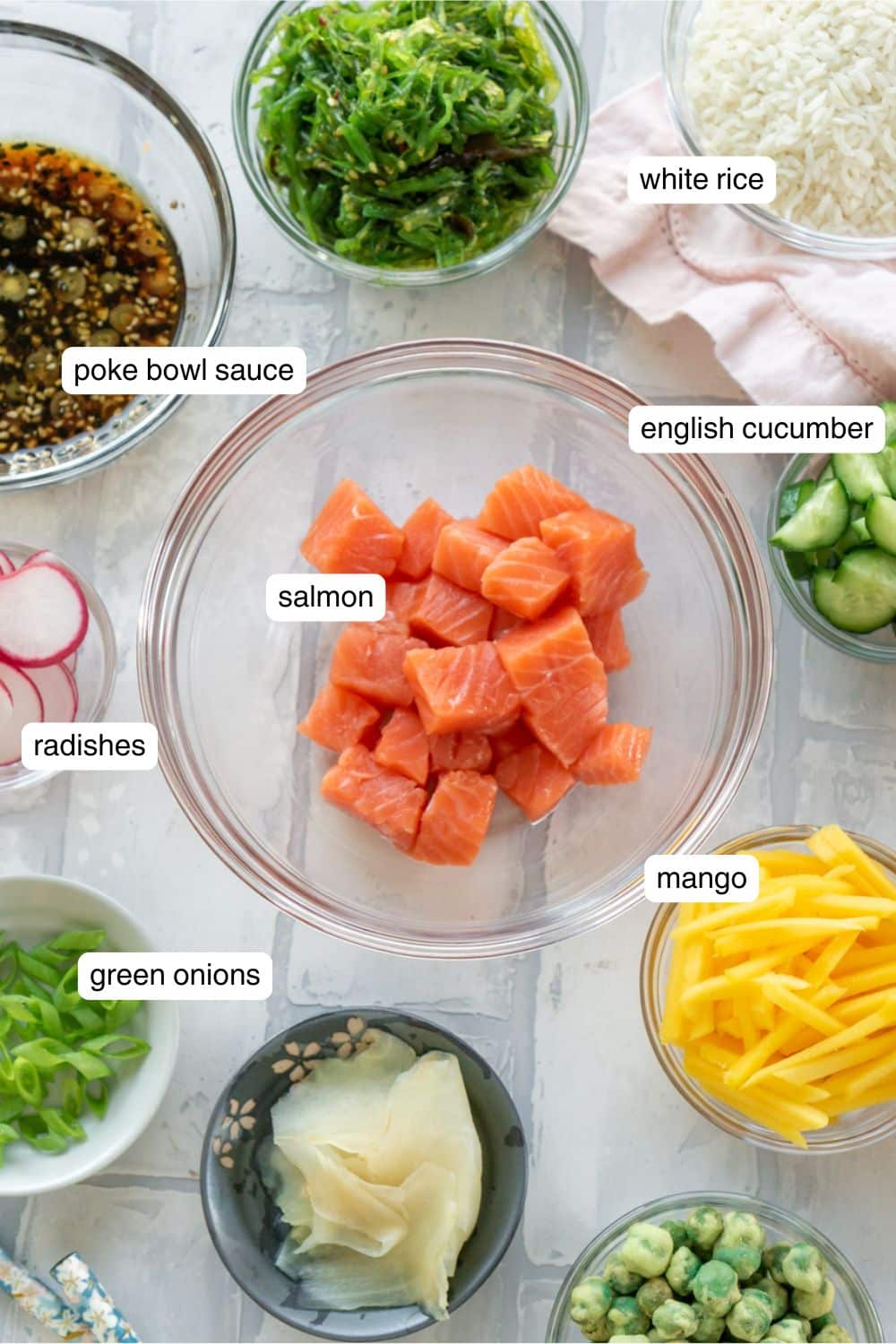 Ingredients to make a salmon poke bowl.