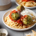 zucchini meatballs with marinara sauce over spaghetti
