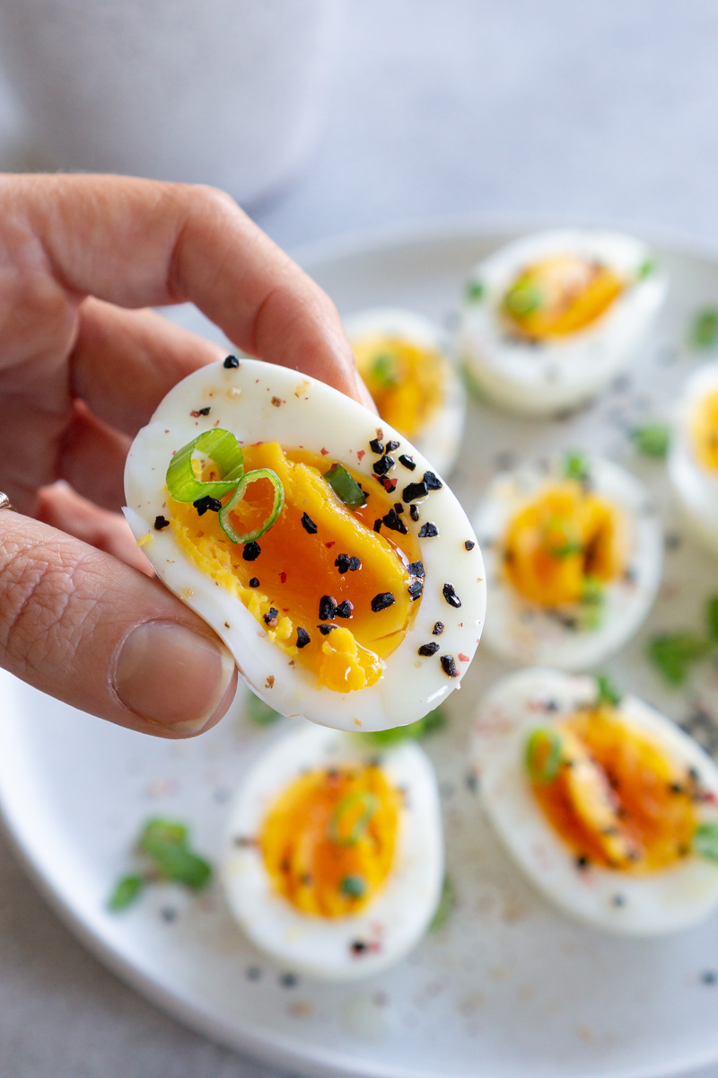 hand holding half a hard boiled egg