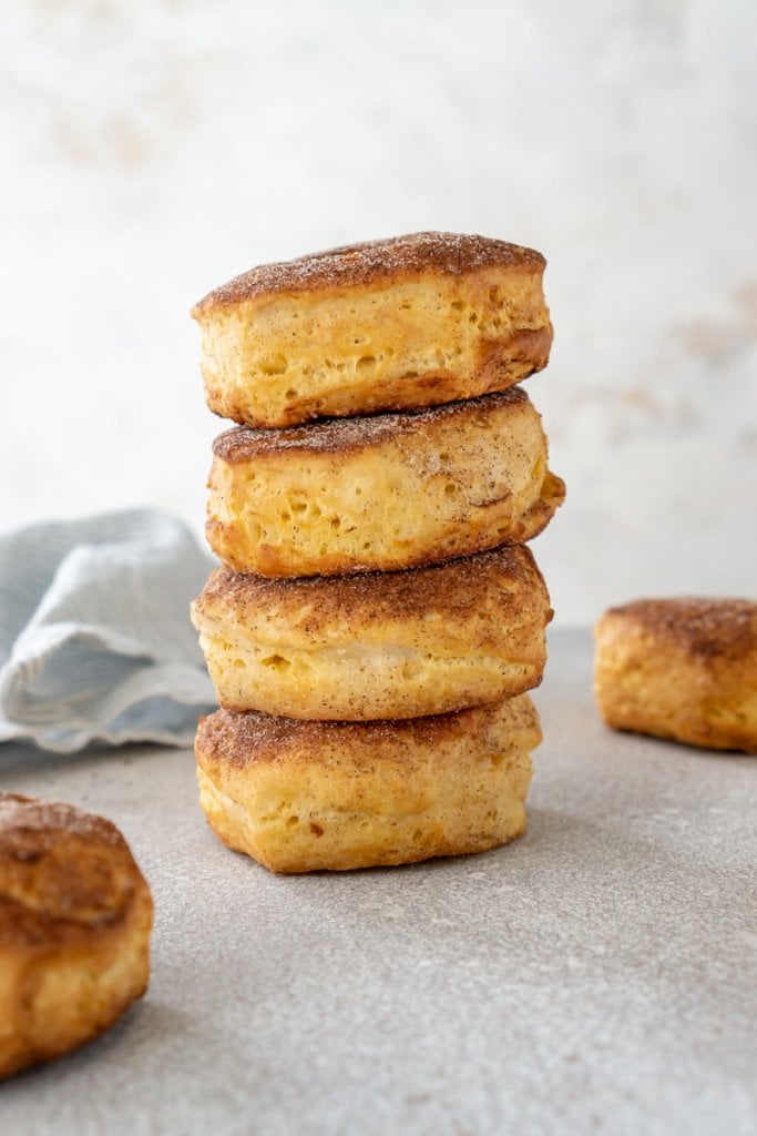 four cinnamon sugar donuts stacked