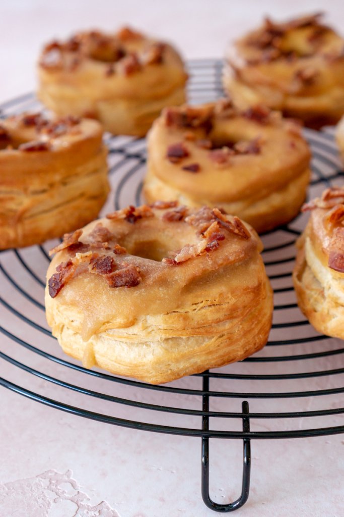 maple bacon donuts on a cooling rack