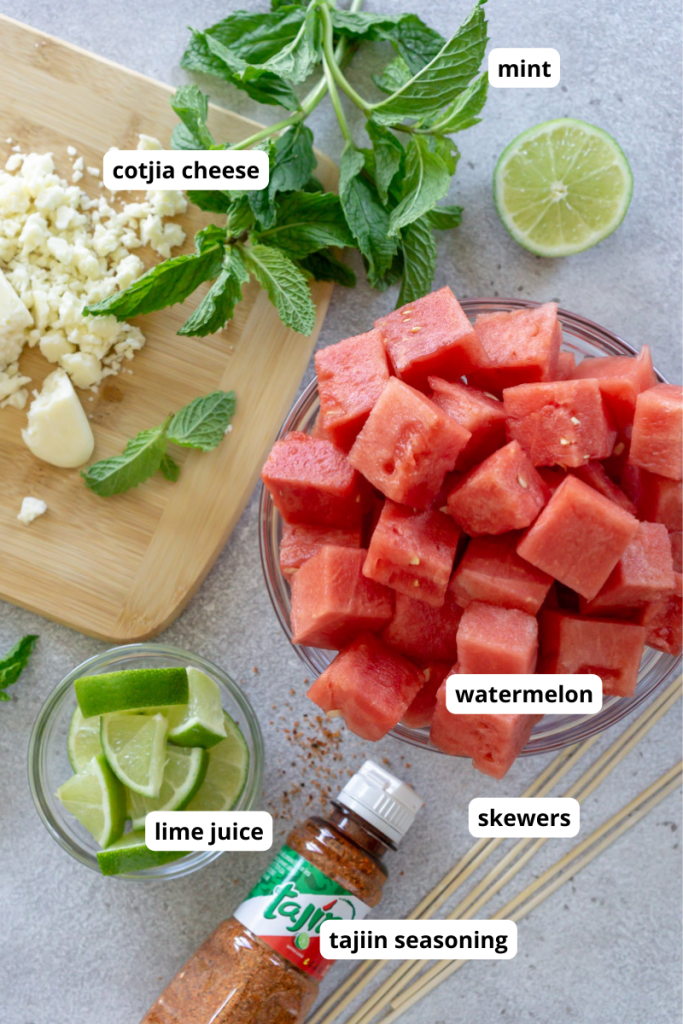 cubed watermelon, fresh mint, lime wedges, tajin, crumbled cotija