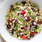 summer corn salad in a white serving bowl