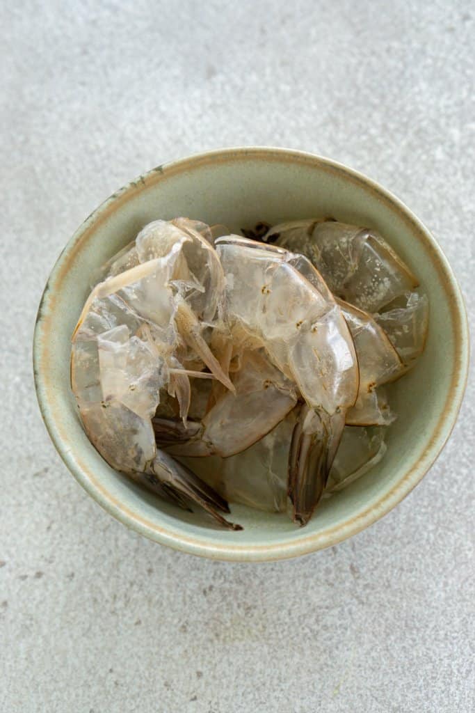 shrimp shells in a small bowl