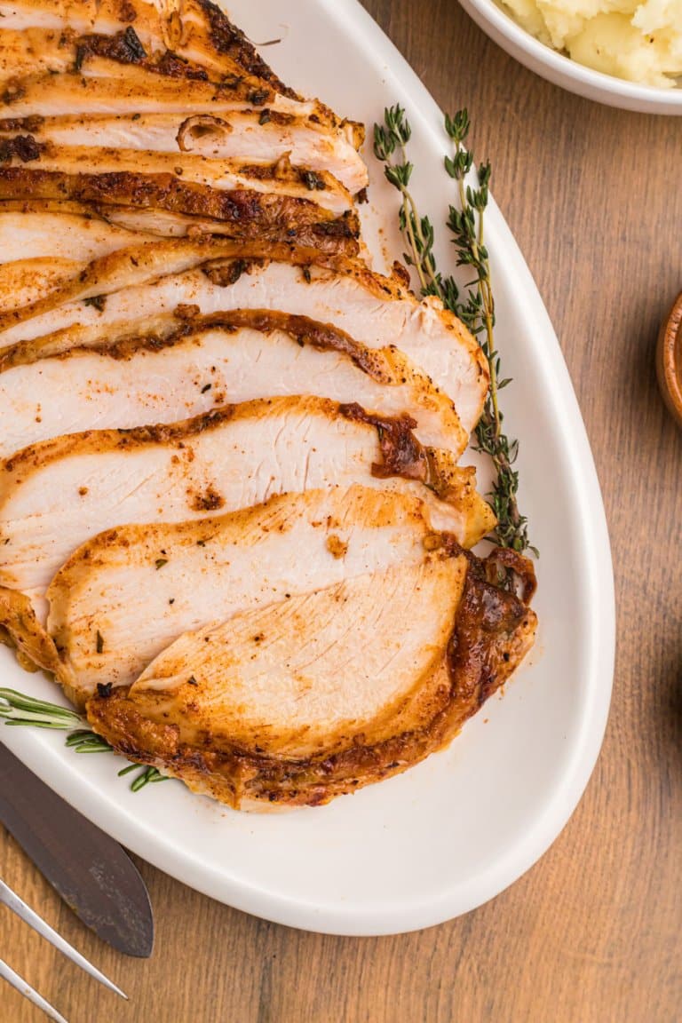 sliced air fryer turkey breast on a plate