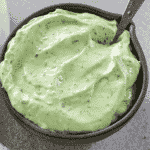 avocado crema in a dark grey bowl