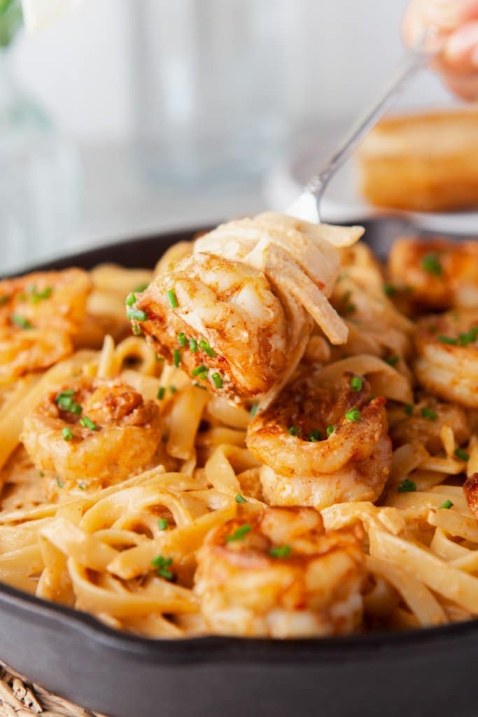 a bite of bang bang shrimp pasta on a fork