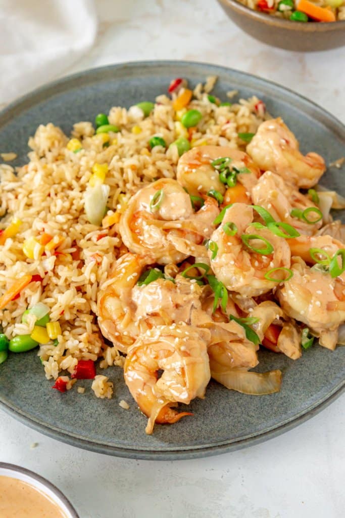 hibachi shrimp on a grey plate with fried rice