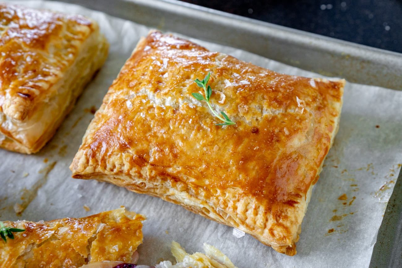 Hand pies on a baking sheet.