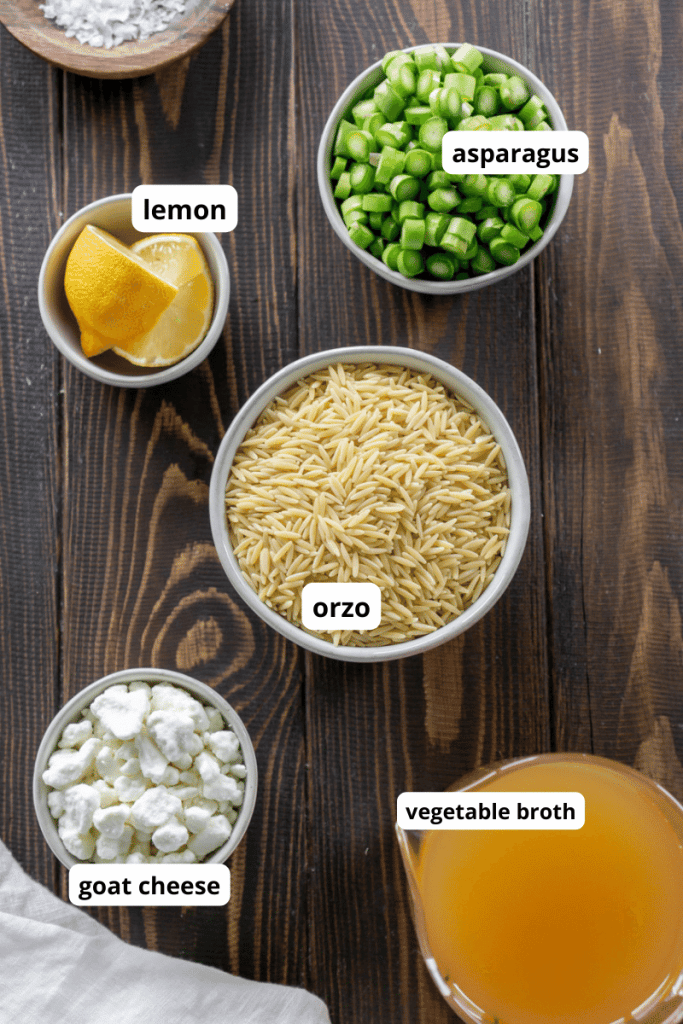 orzo, goat cheese, vegetable broth, asparagus, lemon in small bowls