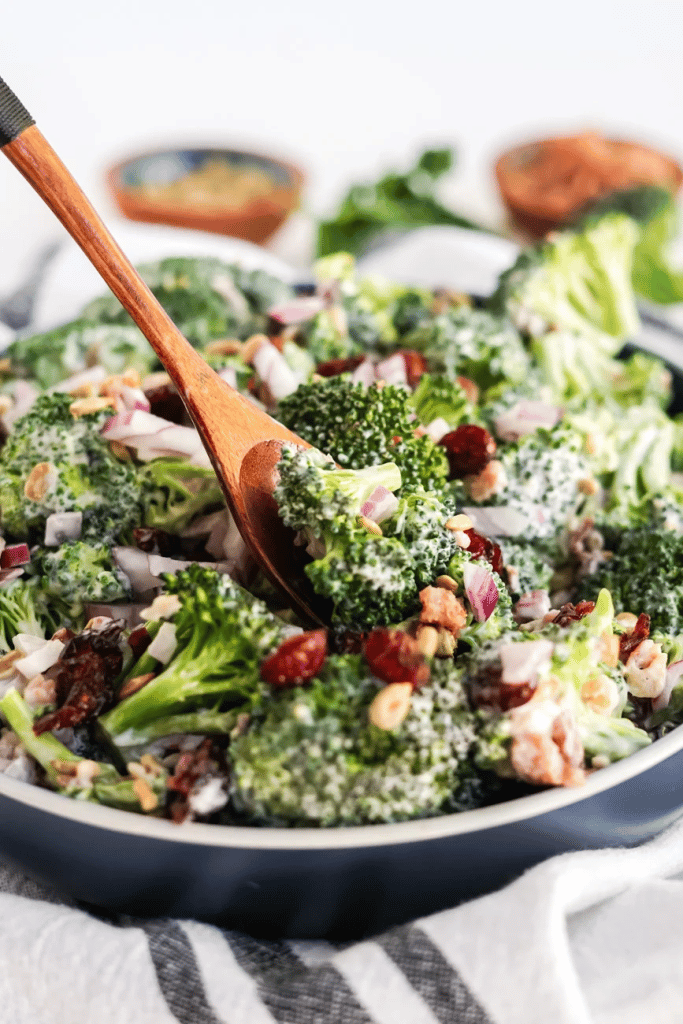 broccoli salad on wooden spoon