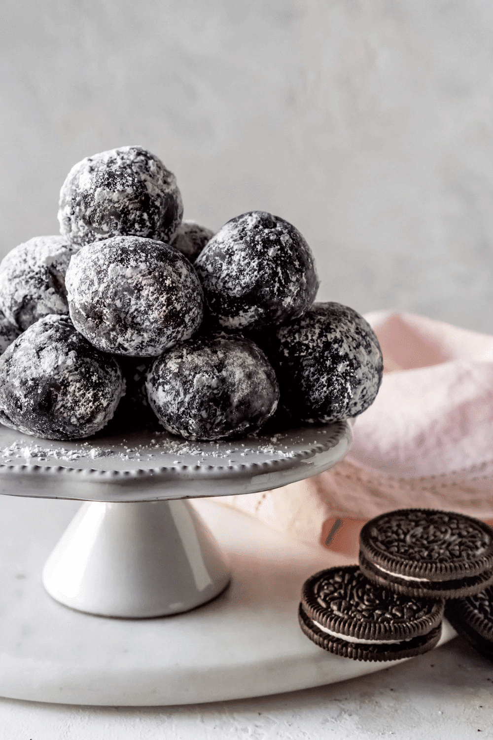 Oreo cookie balls on white platter.