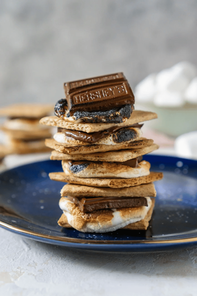 cooked s'mores stacked on top of each other on blue plate