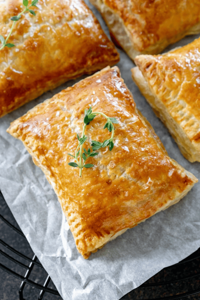 close up of golden brown cranberry apple hand pies 