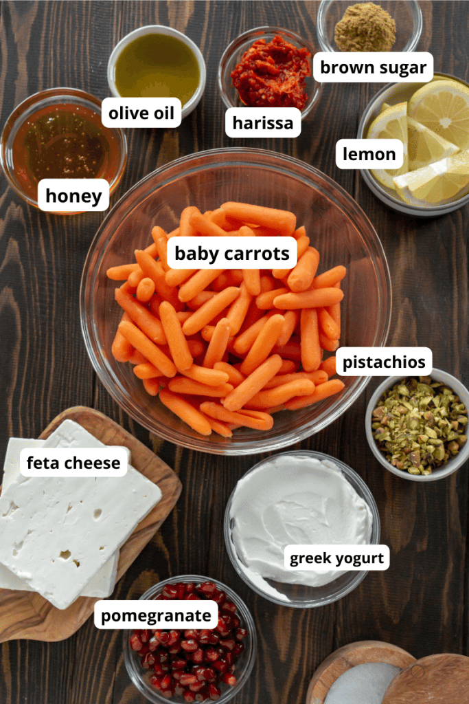 carrots, feta cheese, greek yogurt, pomegranate, lemon slices, pistachios, and honey