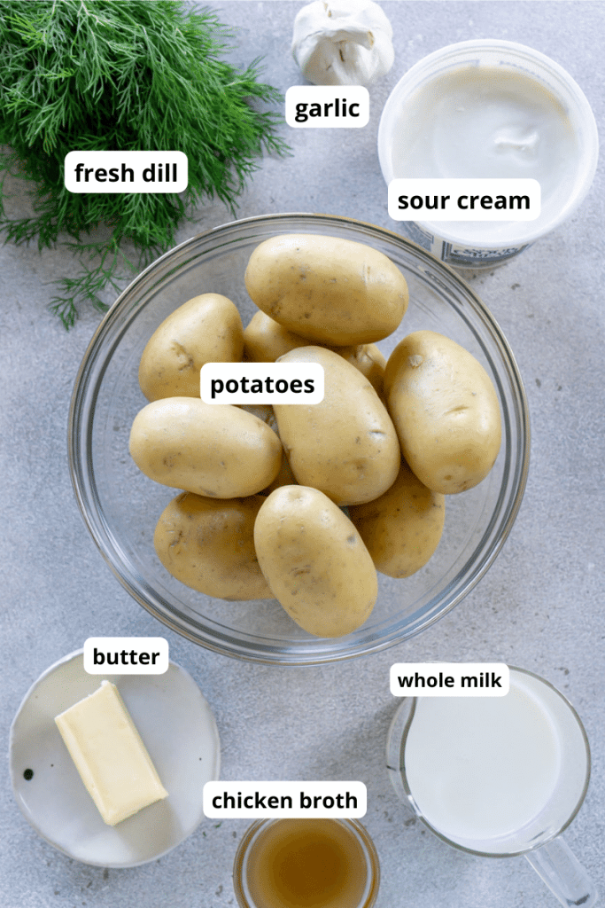 potatoes in a bowl, milk, butter, chicken broth, and dill in small bowls