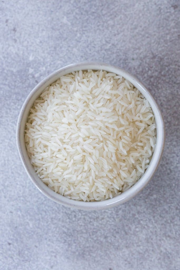 uncooked jasmine rice in a small bowl