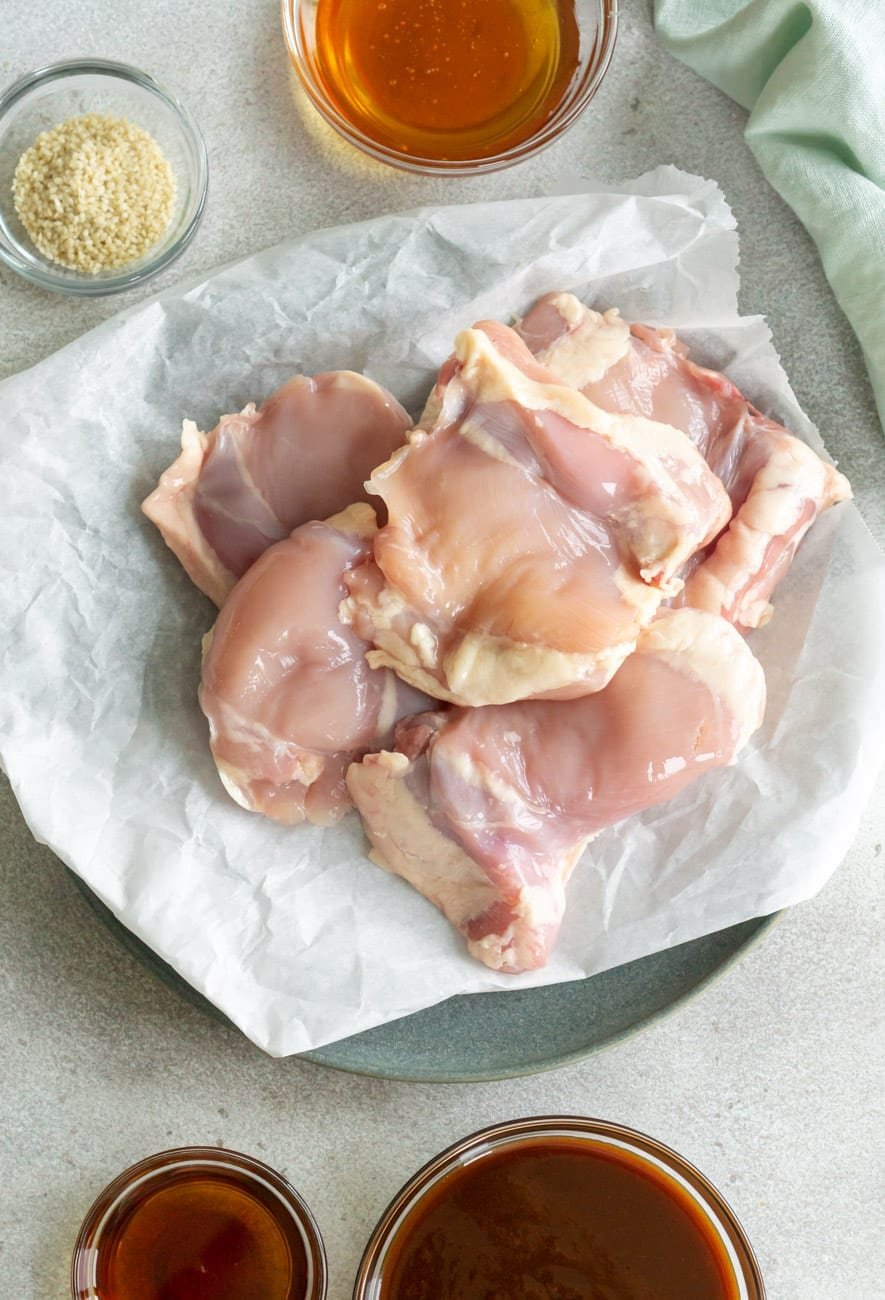 Chicken thighs, hoisin sauce, honey, and sesame seeds.