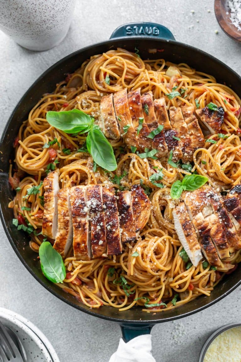 bruschetta chicken pasta in a cast iron pan