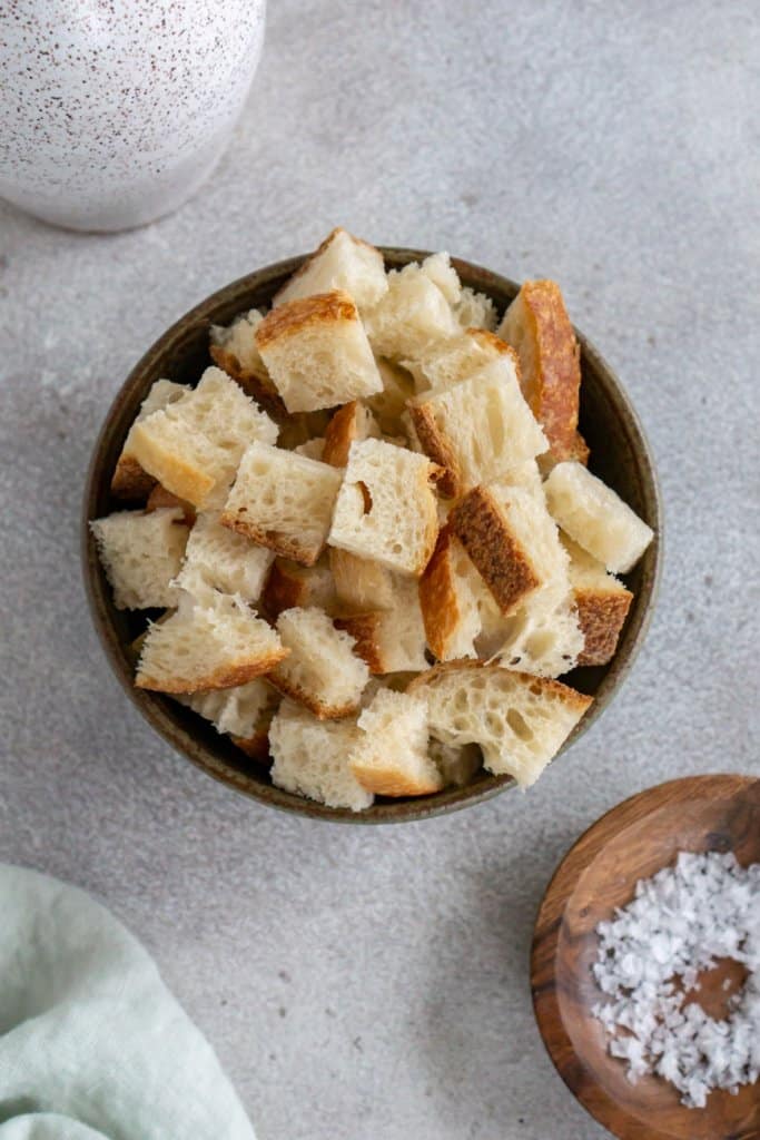 olive oil, salt, and bread in small ingredient bowls