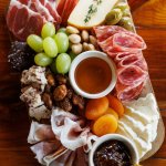 cheeseboard with meats and crackers.