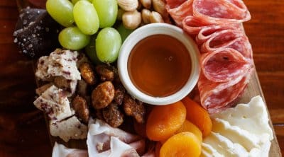 cheeseboard with meats and crackers.