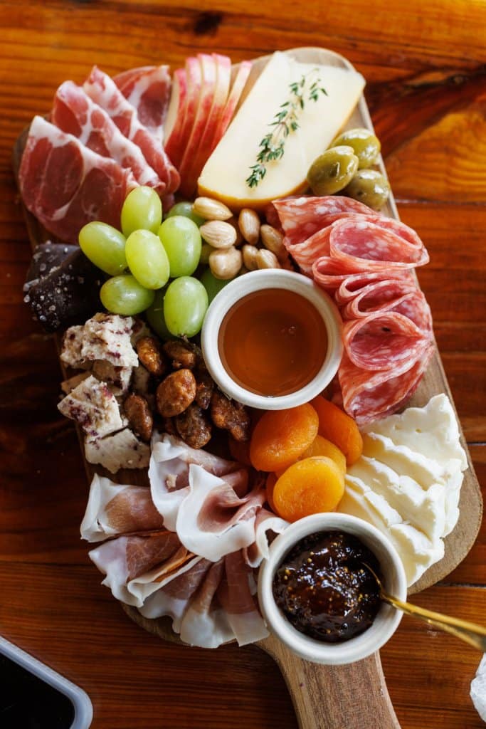 cheeseboard with meats and crackers.