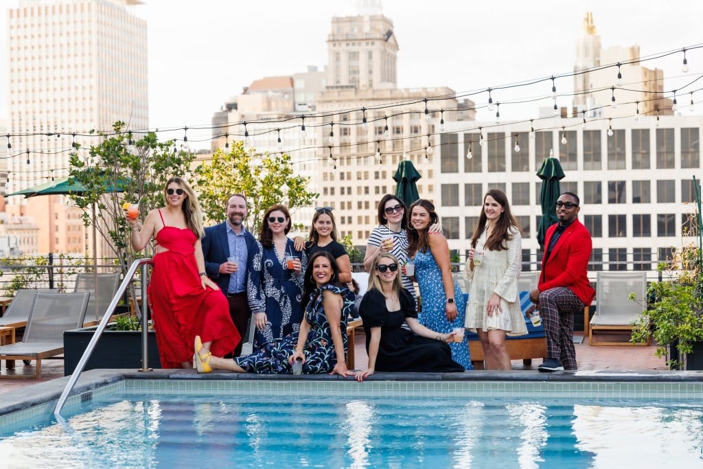 group of people from the retreat by the pool.