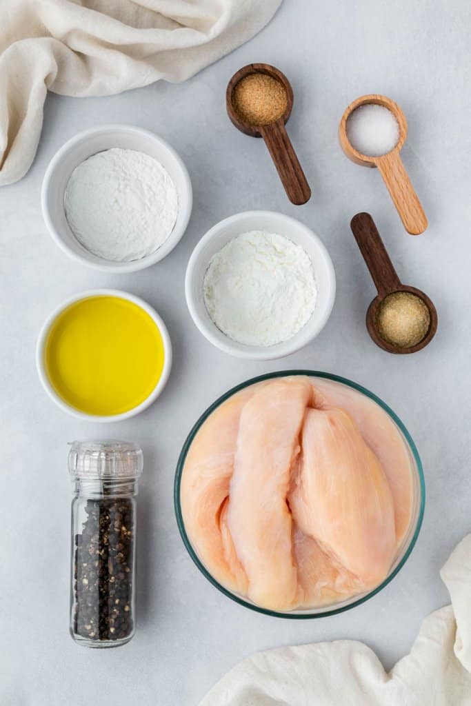 chicken, garlic powder, olive oil, pepper, and cornstarch in small ingredient bowls