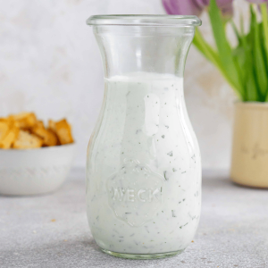 herb ranch dressing in a glass jar