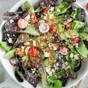 little gem salad in a white bowl