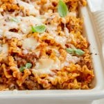 lazy lasagna in a casserole dish with fresh oregano on top