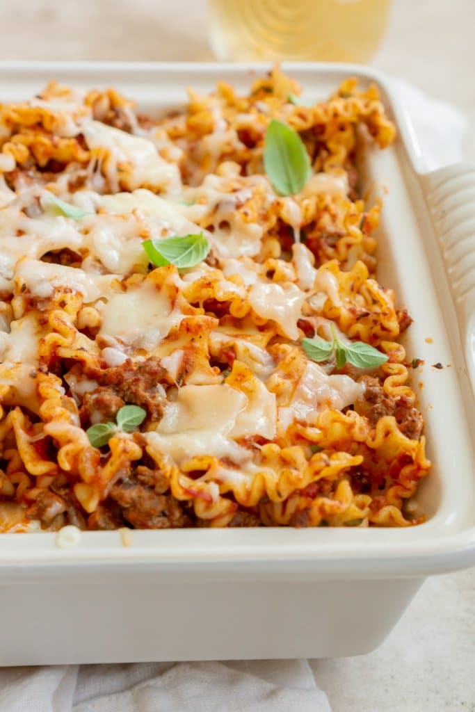 lazy lasagna in a casserole dish with fresh oregano on top