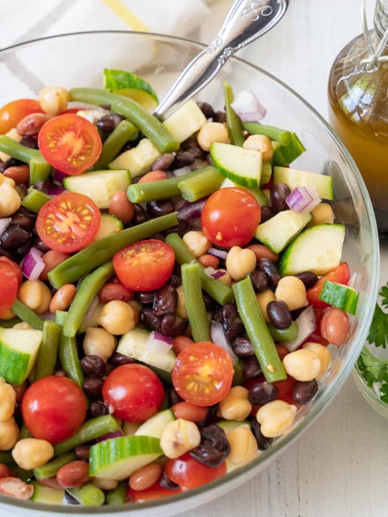 overhead view of Four Bean Vegetable Salad in clear bowl