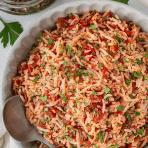 chimichurri rice in a bowl with a spoon