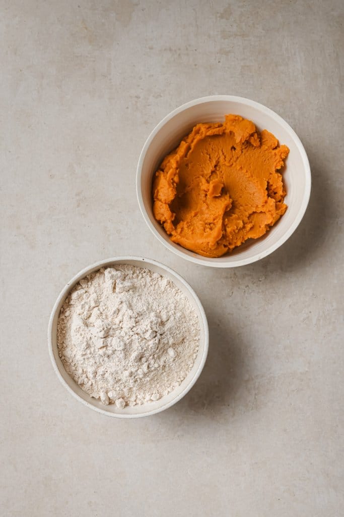 pumpkin puree and cake mix in two ingredient bowls