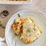 a piece of ground turkey shepherd's pie on a plate with a fork