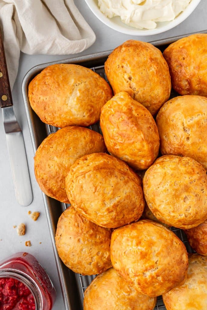 air fryer biscuits on a tray with raspberry jam on the side