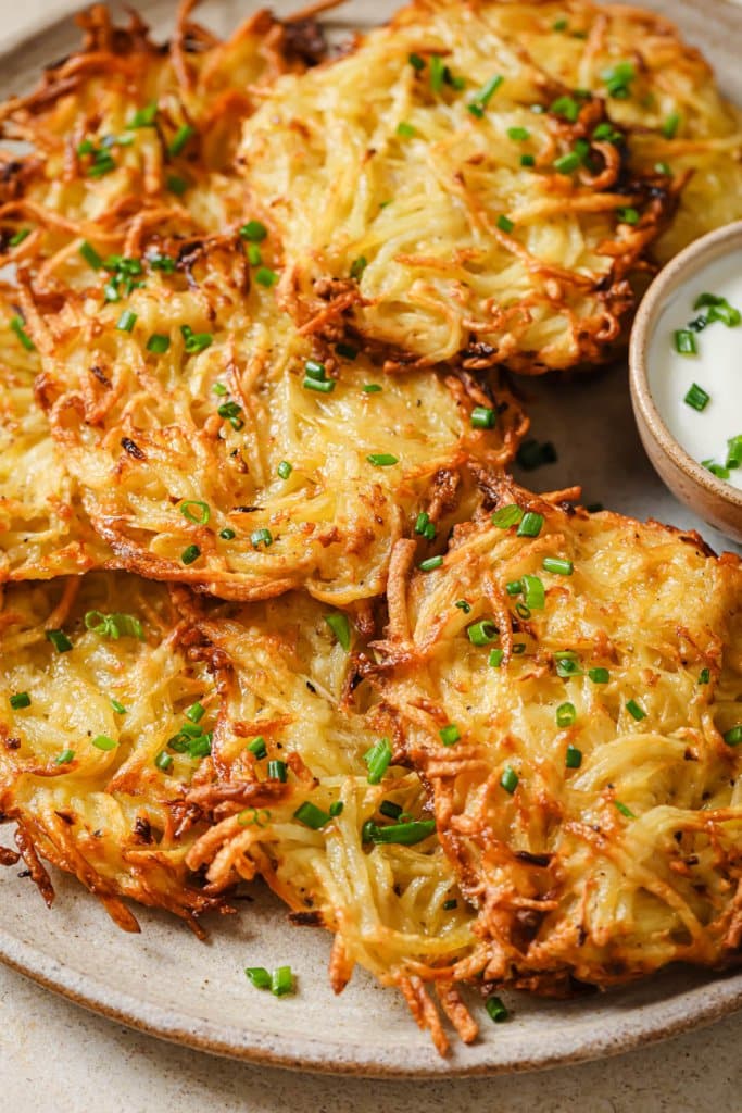 close up of air fryer latkes on a plate