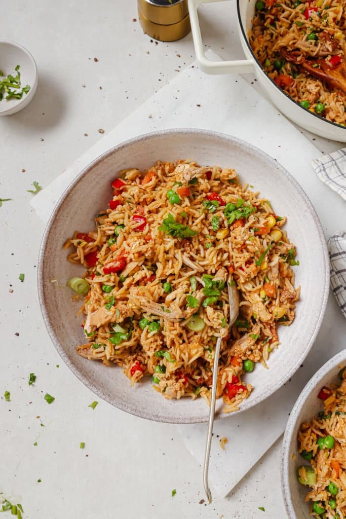 turkey fried rice in a bowl with a fork
