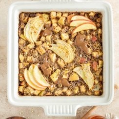 baked apple cinnamon oatmeal in a serving dish with almond butter, salt, and honey on the side