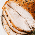 slow cooker turkey breast sliced on a plate